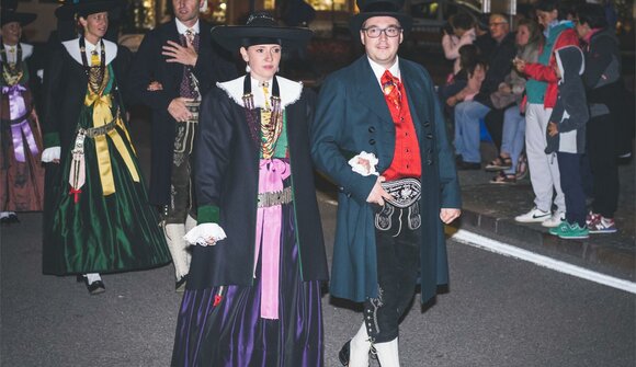 Traditional costume parade in Ortisei