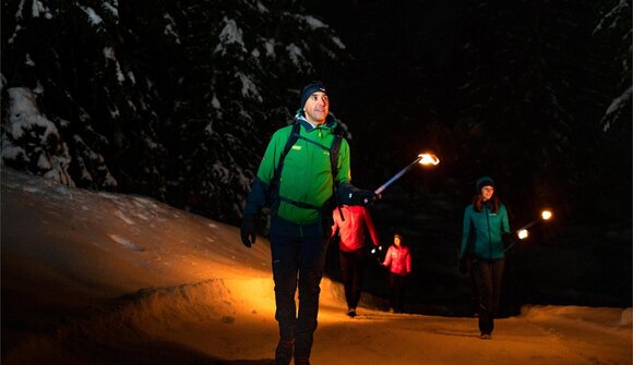 Idyllic torchlight walk to Val d’Anna